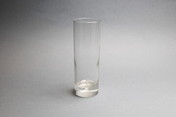 Glass on blue background on the table