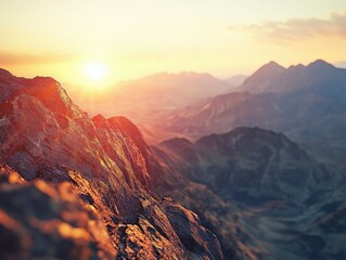 Fototapeta premium Mountain sunrise over rocky terrain with distant peaks visible