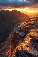 Fototapeta premium Sunset over rocky mountains with golden light