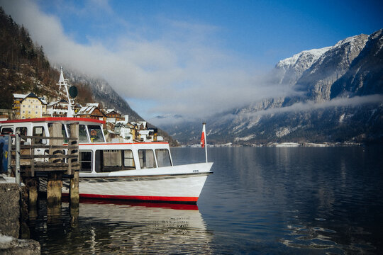 Yacht on a mountain lake with incredible scenery around