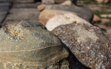 the cracked gray color of the stone surface, texture, details on a natural background.