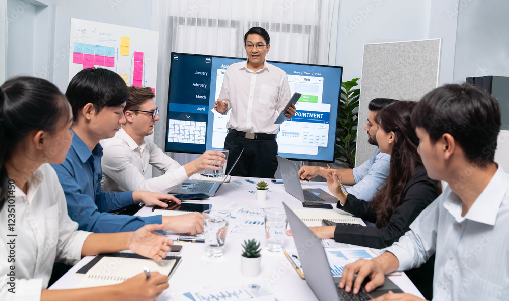 Leinwandbilder Project manager communicate and collaborate with team using project management software display on monitor, tracking progress of project task and making schedule plan at meeting table. Prudent