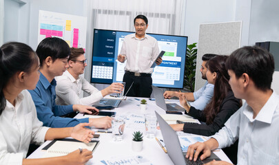 Project manager communicate and collaborate with team using project management software display on...
