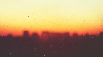 Urban Silhouette at Dusk with Vintage Film Texture