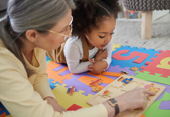 Teacher, therapist and kid with toys for education, learning difficulty or early childhood development. Woman, child or little girl with puzzle for support, tutoring or occupational therapy at home