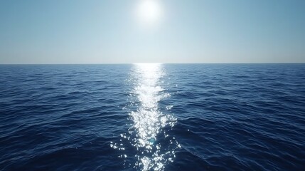 Obraz premium Sunlit Wake Across a Calm Ocean Surface