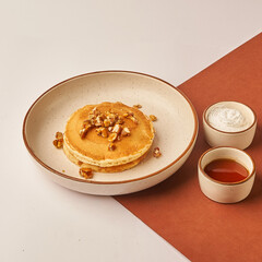 almond pancake with cream and maple syrup 