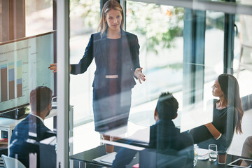 Business woman, meeting and presentation with screen in boardroom for strategy or conference at...