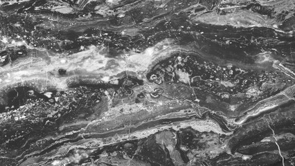 background of a stone wall with a gray and white pattern. The wall looks like it is made of marble...