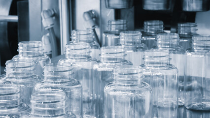 Bottle. Industrial production of plastic pet bottles. Factory line for manufacturing polyethylene...