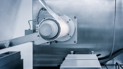 Industrial machine for production and printing of polyethylene bags. Industrial concept background