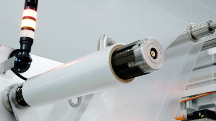 Industrial machine for production and printing of polyethylene bags. Industrial concept background
