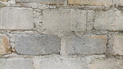 Stone texture background of grey brick wall, closeup texture of stone bricks