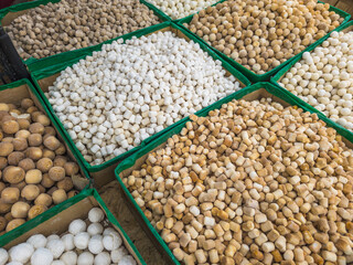 Qurut in boxes on the counter of an Asian market