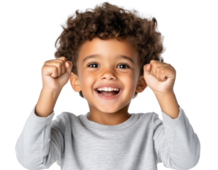 Young boy expressing joy with raised fists against a transparent background, showcasing happiness and excitement