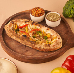 crispy garlic base bread topped with mozzarella fresh vegetables 