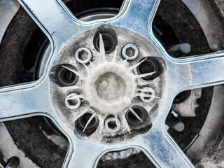 radial icicles on car wheel formed during winter driving