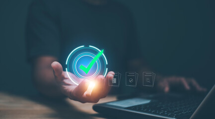 Audit document concept, Businessman holding check mark icon for show audit document, Business document evaluation, Information report analysis and consulting. Quality assessment.