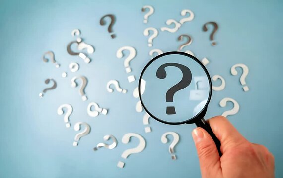 Uncover the Truth: Root Cause Analysis Concept. A hand uses a magnifying glass to investigate a central question mark amidst a field of smaller question marks, 