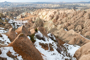 Rock formations of the Red Valley (Valley of Roses), Cappadocia, Turkey , in winter
