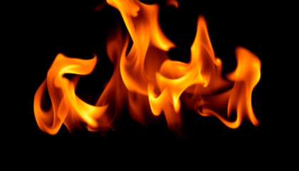 Fototapeta premium Isolated yellow and orange flames on a black background, creating a bold visual representation of fire, heat, and energy in motion.