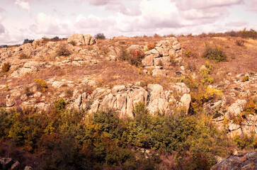 fantastic autumn in a mountain canyon, huge rocks