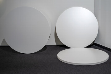 Composition of two white discs of podiums that are well suited as a stand or display for...