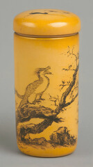 Obraz premium Yellow cylindrical container with bird and tree painting, studio shot, gray background, tea storage
