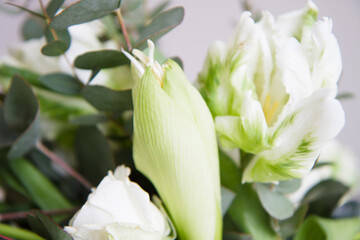 elegant stylish bridal bouquet wedding bouquet in white and green tones contains roses, orchids,...