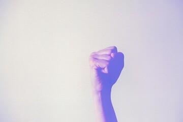International Women's Day 2025: Accelerate Action. Woman hand gesture. Female hand with clenched...