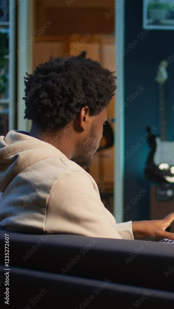 Poster vertical video remote worker accountant doing math calculations using financial graphs on laptop, wo
