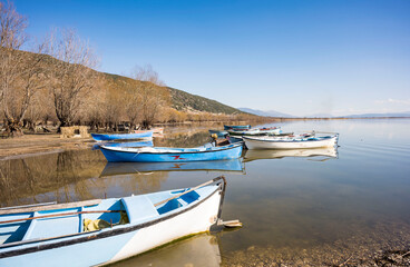 Fototapeta premium Decorated day-trip boats in Isikli Lake in Denizli's Civril district. Isıkli Lake is flooded with visitors during lotus time. It is also a popular lake for hunters.