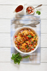 cauliflower chickpea quinoa salad in a white bowl