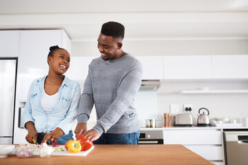 Black couple, help and smile with recipe, vegetables and support for healthy breakfast in kitchen. African woman, man and collaboration for home nutrition, diet meal prep and food subscription