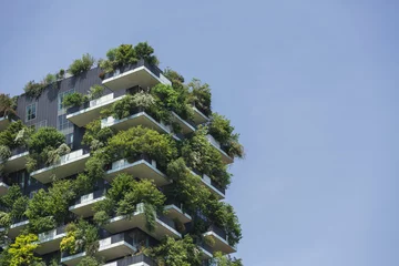 Fototapete Rund Residential tower, an example of modern architecture with various plants and tree-covered balconies. Sustainability and tree skyscraper concept. © 24K-Production