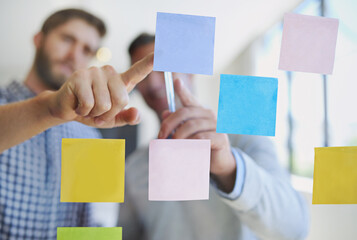 Business people, hands or meeting with schedule planning for brainstorming, tasks or reminder at office. Closeup, employees or sticky notes with team for agenda, ideas or collaboration on glass board