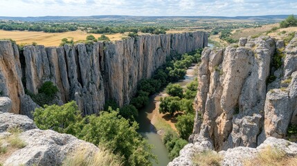 River Gorge With Tall Rock Cliffs And Lush Greenery