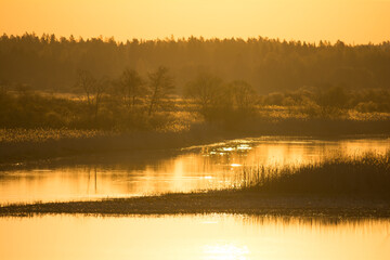 Spring time sunrise at the river delta in Finland