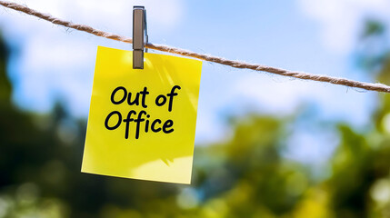 Fototapeta premium Out of office sticky note on clothesline outdoors 