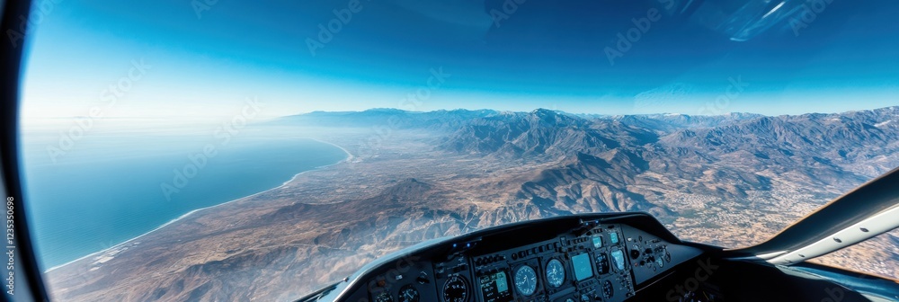 Aufkleber panoramic view of mountains and coastline from an airplane cockpit during a clear day flight. genera