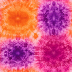 A colorful tie dye design with a purple and orange center