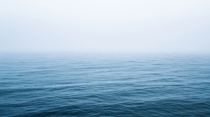 Obraz premium Serene Ocean Vista: A Misty Seascape