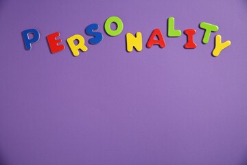 Word Personality made of colorful letters on purple background, top view. Space for text