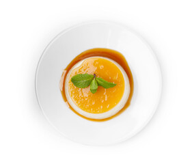 Tasty pudding with caramel sauce and mint isolated on white, top view