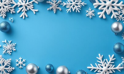 White snowflakes and blue and silver ornaments frame a light blue background, ideal for holiday themes