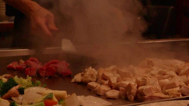 Teppanyaki Chef Cooking in Slow Motion