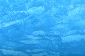 simple background in blue with brush strokes and scratches