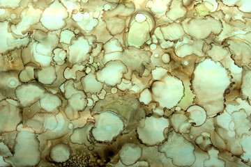 simple background of ink blots in green brown color