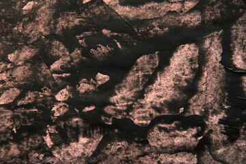 simple background of black stains on pink paper