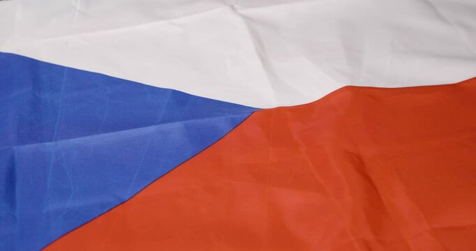 A montage of blue, white, and red flags highlights national identity